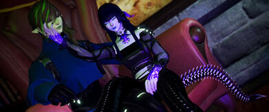Lylisandre & her partner Ley sit smugly together in a wingback chair